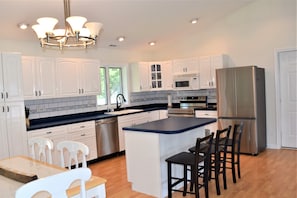 Beautiful updated kitchen with stainless steel appliances and plenty of counter space to prepare gourmet meals!
