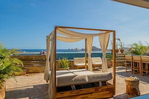 Canopy bed with an ocean view