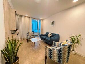 Living room with private balcony.