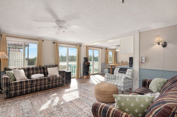 Cozy up by the fire in this spacious living room with stunning views!