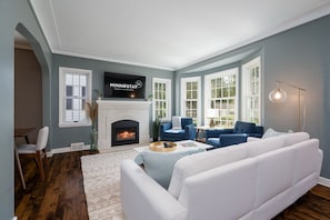 Beautifully appointed living room, both bright and cozy for gathering your group