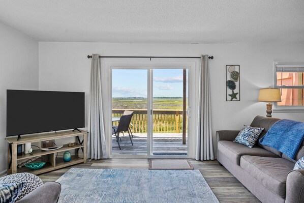 Enjoy watching gorgeous sunsets or your favorite TV show in our living room.