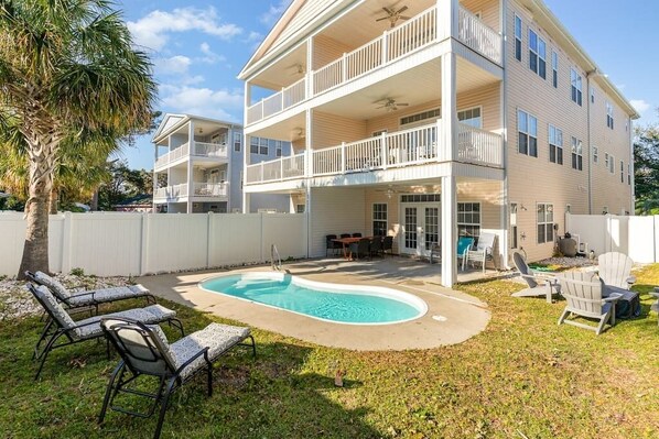 Tranquil outdoor space with private pool and outdoor dining and lounge areas