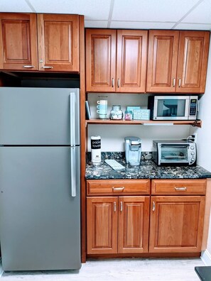 Kitchenette with full-sized refrigerator, microwave, and toaster oven