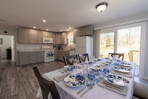 Open and spacious kitchen and dining area are adjacent to living room