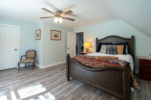 West Room is spacious and has an oversize queen bed and sleeps two guests  