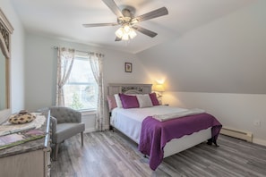 Spacious East room has a queen size bed and comfortably sleeps two guests