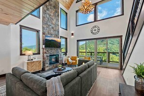 Enjoy the beauty of nature while relaxing by the fireplace.