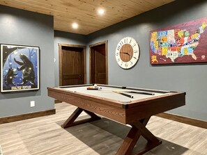 Time to level up your fun! Game night awaits in this cozy game room! 