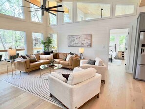 The main living room is adjacent to the master bedroom and  a guest room making the top level of the home an excellent single level experience.