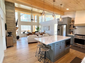 Our open concept allows the kitchen and living room dwellers to still be together.  