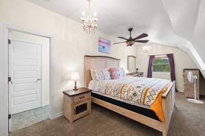 master bedroom eurotop comfort kingbed, dresser and Scenic Hillview windows