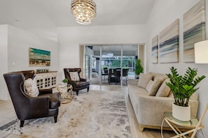 Enjoy the Sitting Room with Custom Chandelier and Comfy Furniture