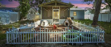 “The Dog Park” decorated with fun doghouses, fire hydrants, and 3 grass tires!