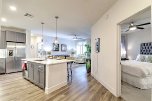 Whip up meals in the modern kitchen, fully stocked with appliances, cookware, and essentials for everyday cooking.