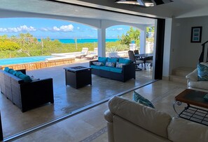 Poolside entertainment deck overlooking Grace Bay