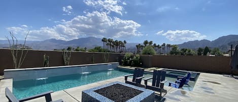 outdoor fire area next to pool w waterfalls view no neighbor to the right 