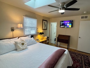 Master brrm has remote skylight shade, smart TV, en suite bathroom, king bed...