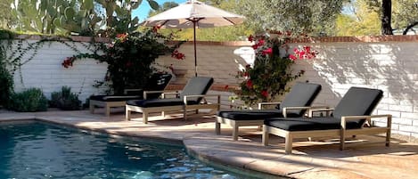 Pool with four Pottery Barn sun loungers & umbrella