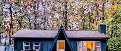 A-frame cottage surrounded by woods and beautiful trees :) 