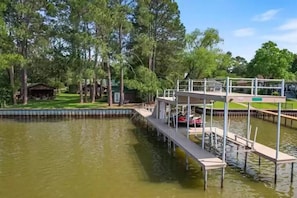 Two story dock. Huge property with beautiful pine trees. 