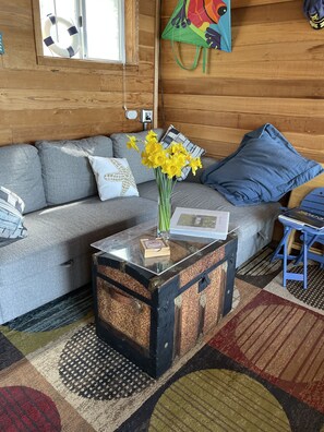 Living area space looks out to bay