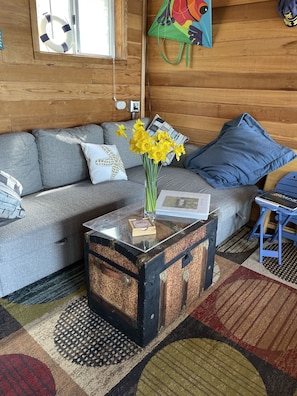 Living area space looks out to bay
