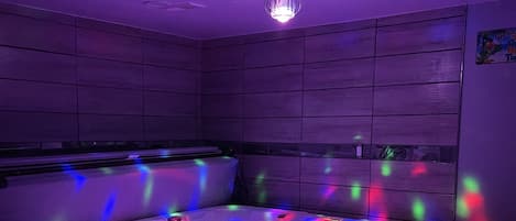 Entertainment garage hot tub with lights