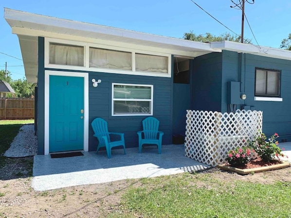 exterior facade of the house with garden chairs