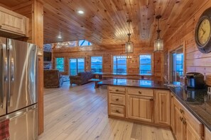 Open concept granite kitchen living area
