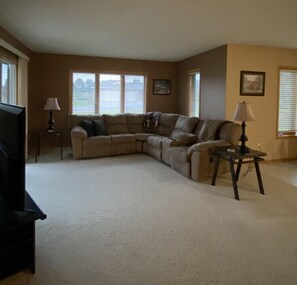 Living room. To the left is the sliding glass door to the patio with gas grill.