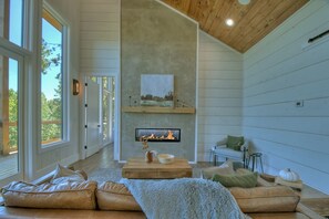 The gas 42" dual sided fireplace warms the living area