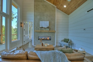 The gas 42" dual sided fireplace warms the living area