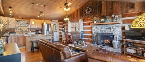 Large Living Room kitchen area with wood burning fireplace