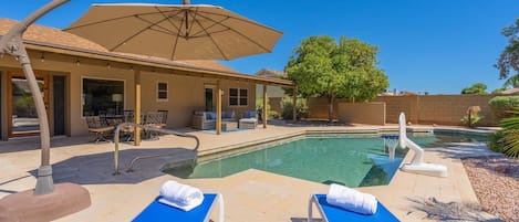 Huge heated pool with plenty of sitting spaces to enjoy the oversized back yard.