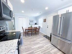 Dining area in the kitchen with seating for 8 people.