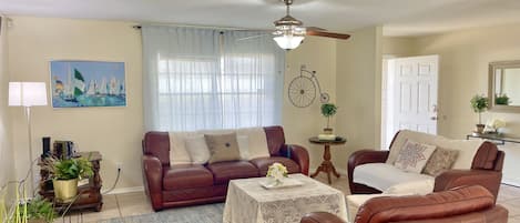 Warm, Cozy living room with super comfortable leather couches for your leisure
