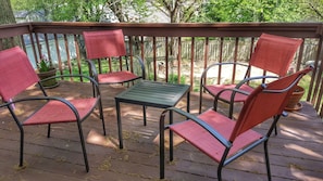 The large balcony deck with 6 chairs, 2 tables. Great for gathering or relaxing.