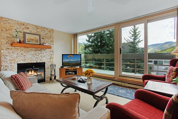 Living Room with Cable TV and Wood Burning Fireplace