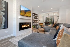 Comfortable Sectional with Two Chaises and Cozy Electric Fireplace