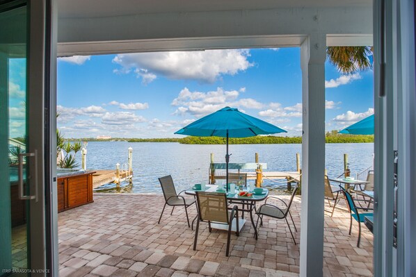 Sliding doors off the living room allow for spectacular water views! (no hot tub)