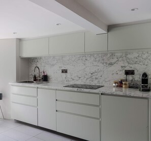 Islington Townhouse contemporary kitchen featuring a marble countertop