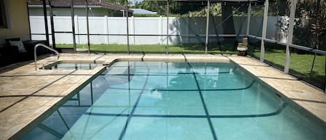 Large pool with built in hot tub 