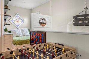 Game room with foosball and giant Connect 4, adjacent to our cozy reading nook.