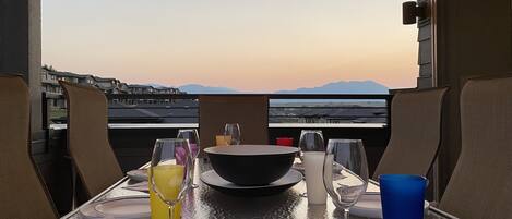 Rooftop patio with large table for entertaining. 