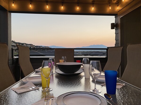 Rooftop patio with large table for entertaining. 