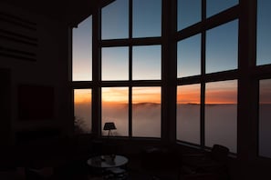 Watching the sunrise early morning from the floor to ceiling windows in the living room.