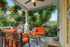 Rest & Relax on our multiple porches overlooking Maurepas St.