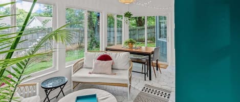 The sunroom is the perfect place to relax and chat.