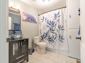 Beautiful bathroom with free shampoo, body wash, toilet paper & comfortable bath towels. Tub also just in case you need for kids.